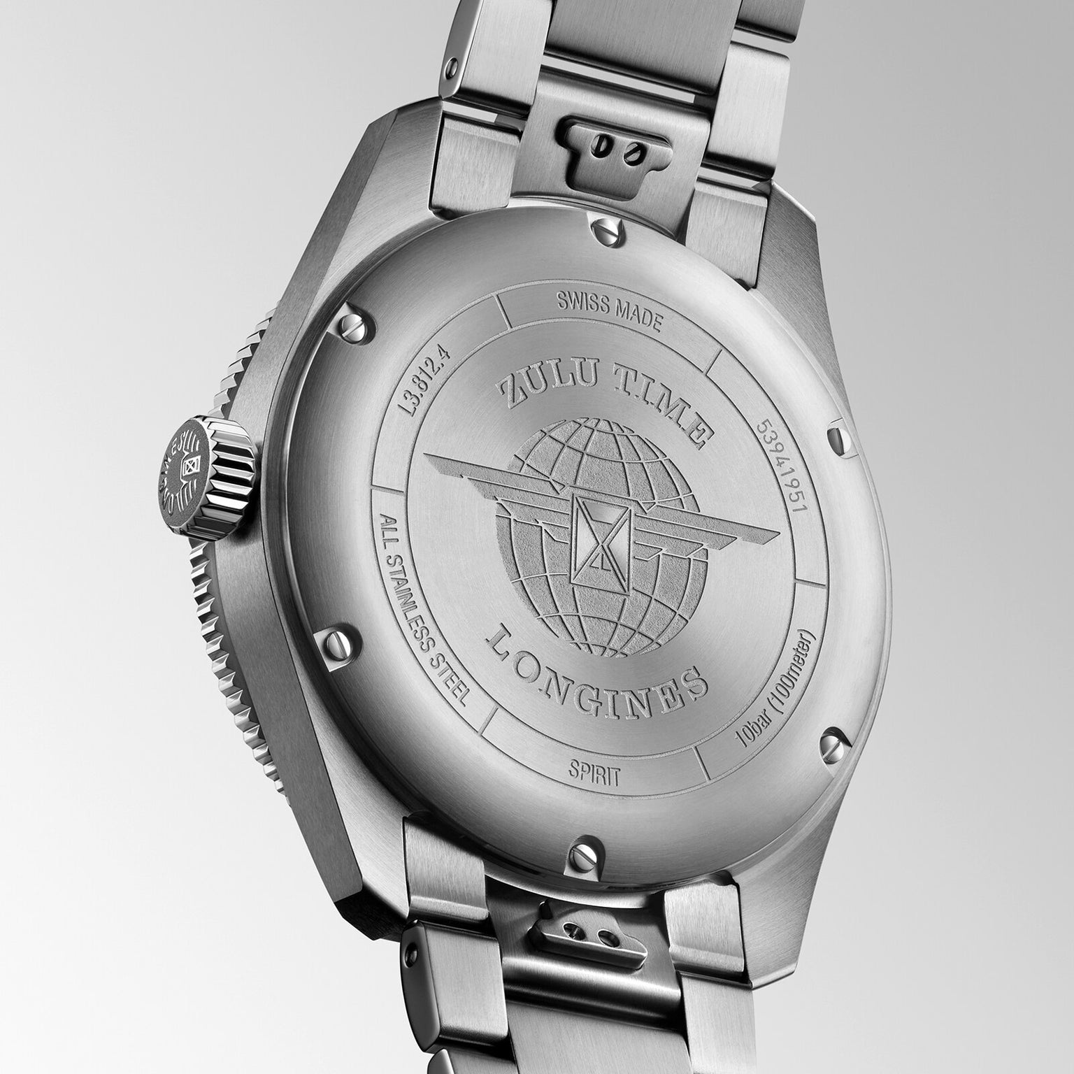 Close-up of the Longines Spirit Zulu Time’s stainless steel case back, featuring engraved text and a globe with wings design that showcases the craftsmanship behind every Longines timepiece.