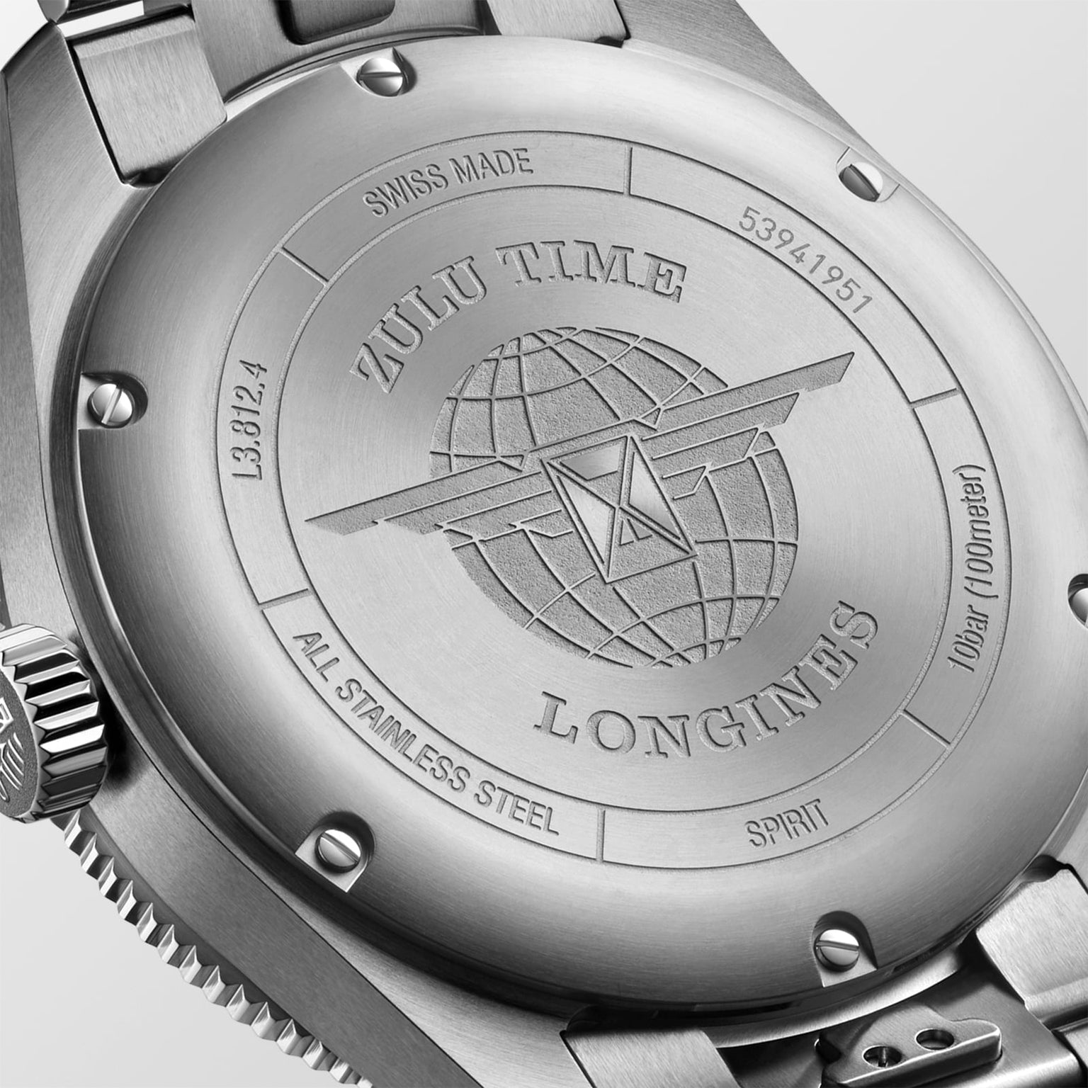 Close-up of the Longines Spirit Zulu Time’s case back shows engraved text, a globe with wings logo, and serial/model numbers on its stainless steel case.