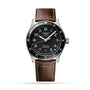 The Longines Spirit Zulu Time features a stainless steel case, black dial with silver hour markers, date at 6 o’clock, brown leather strap, and a black bezel with white numerals for tracking multiple time zones.