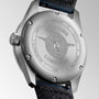 Close-up of the stainless steel case back of the Longines Spirit Zulu Time watch, featuring Zulu Time engraving, a globe with wings logo, serial numbers, and a partially visible black leather strap.