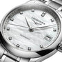 Close-up of the Longines Master Collection wristwatch featuring a silver case, white textured dial, diamond hour markers, and date display at 3 o’clock—a refined showcase of Longines’ craftsmanship.