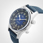 A close-up of the Longines Legend Diver, featuring an automatic movement, blue dial, dual crowns, and a blue fabric strap set against a plain background.