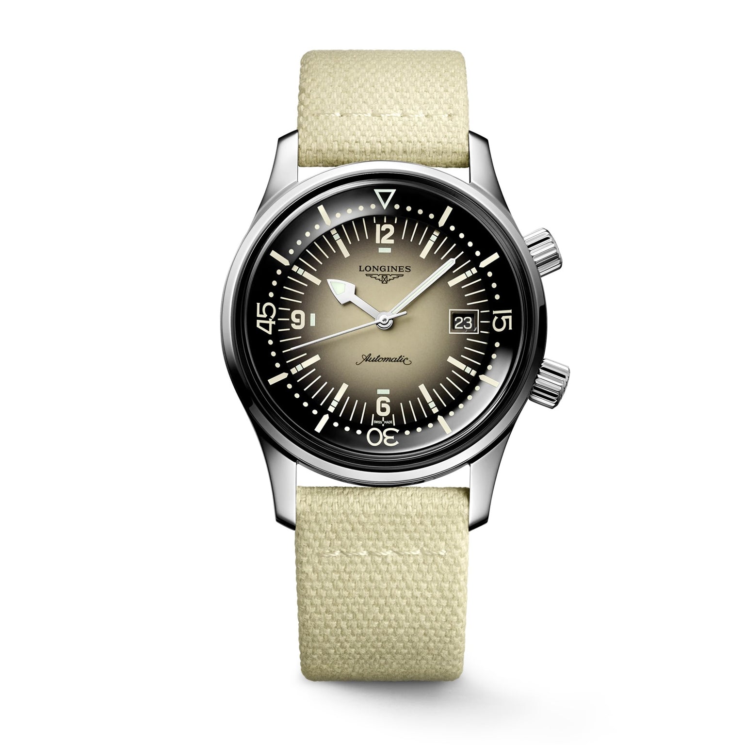 The Longines Legend Diver features a stainless steel case, gradient black-to-beige dial with white markers, two crowns, date at 3 o’clock, light beige fabric strap, and is powered by the precise L888 calibre movement.