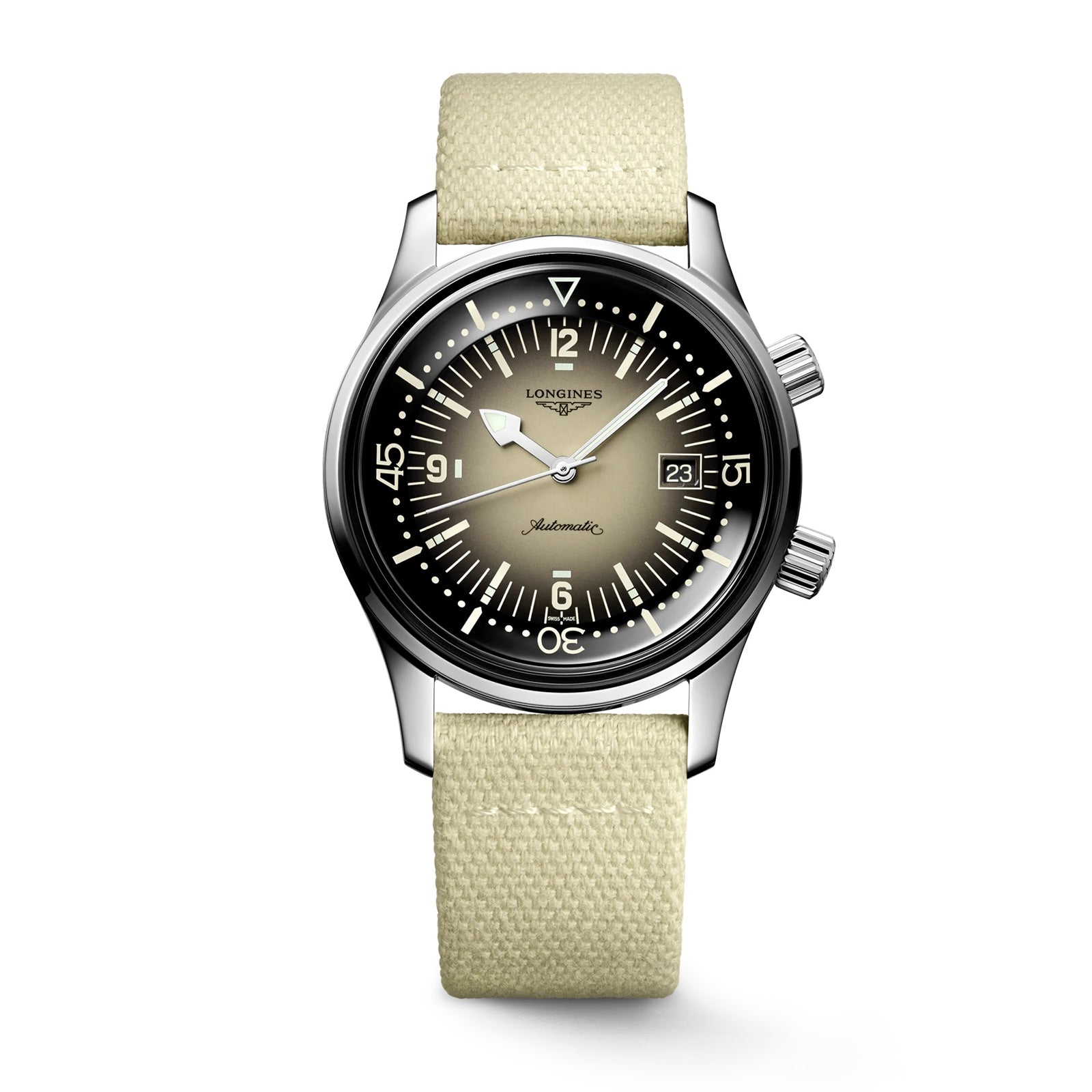 The Longines Legend Diver features a stainless steel case, gradient black-to-beige dial with white markers, two crowns, date at 3 o’clock, light beige fabric strap, and is powered by the precise L888 calibre movement.