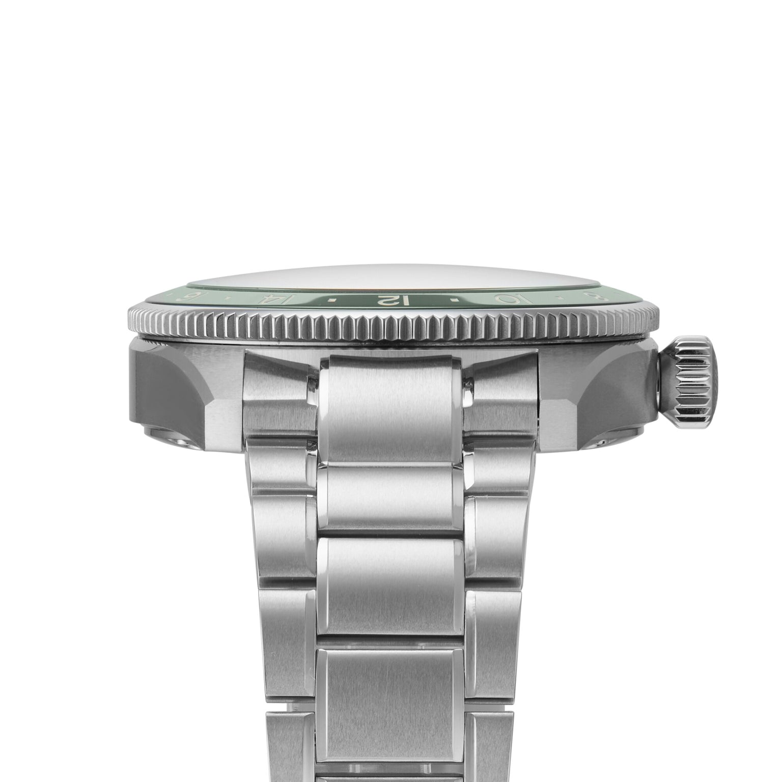 Side view of the Longines Spirit Zulu Time wristwatch featuring a stainless steel case, metal bracelet, and distinct green ceramic bezel, highlighting the crown and watch case thickness.