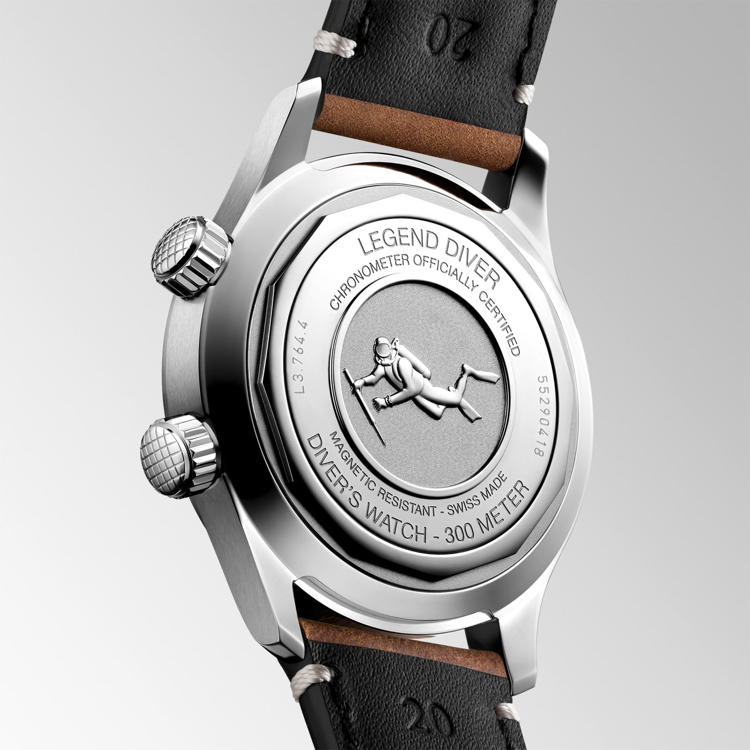 Close-up of the back of the Longines Legend Diver watch, featuring engraved text, a diver illustration, and a stitched leather strap.