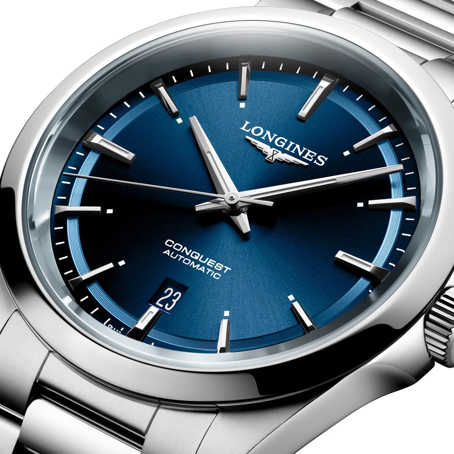 Close-up of the Longines Conquest, featuring a sunray blue dial, silver markers and hands, L888 automatic movement, date at 6 o’clock, and a stainless steel bracelet.