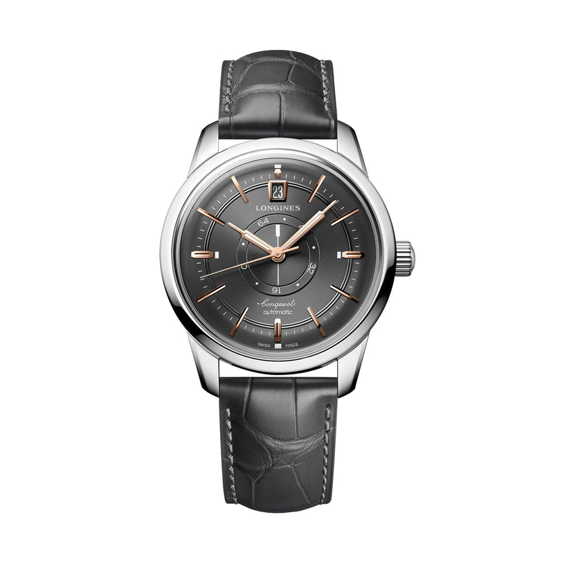 A Longines Conquest Heritage Central Power Reserve wristwatch with a dark gray face and black leather strap is displayed on a white background.