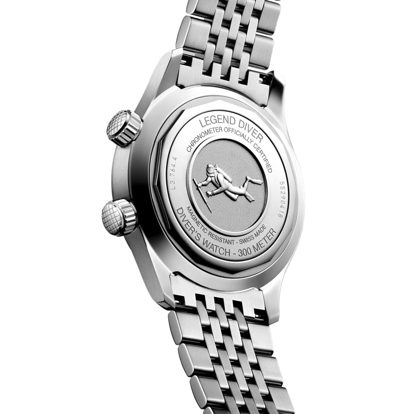 Close-up of the Longines Legend Diver’s stainless steel caseback, engraved with a diver image, performance specs, and text indicating 300m water resistance and chronometer certification.