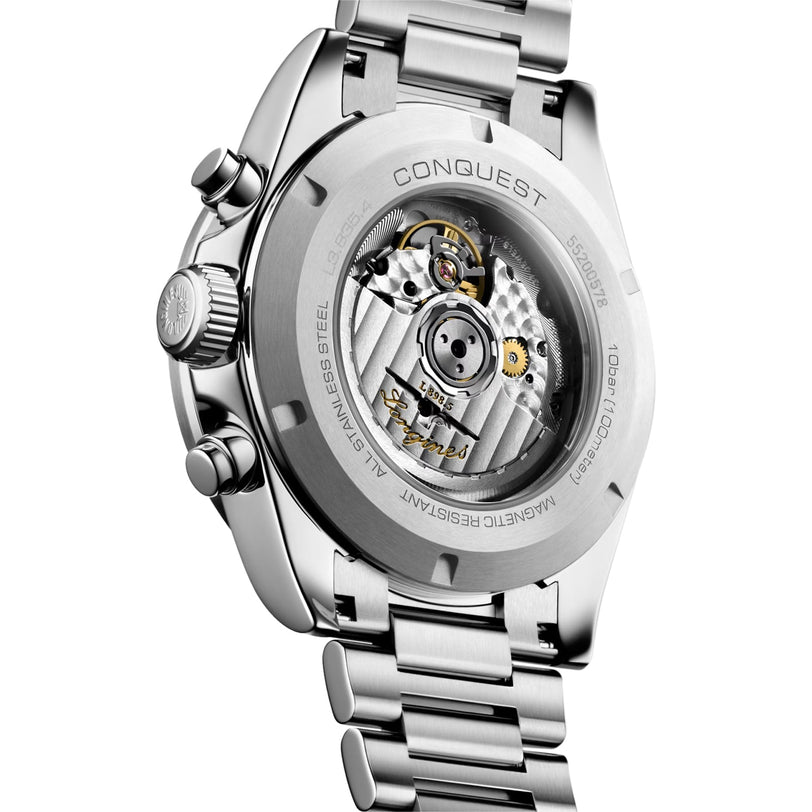 Close-up view of the back of a Longines Conquest Chronograph, highlighting its self-winding movement and engraved details on the stainless steel case back.