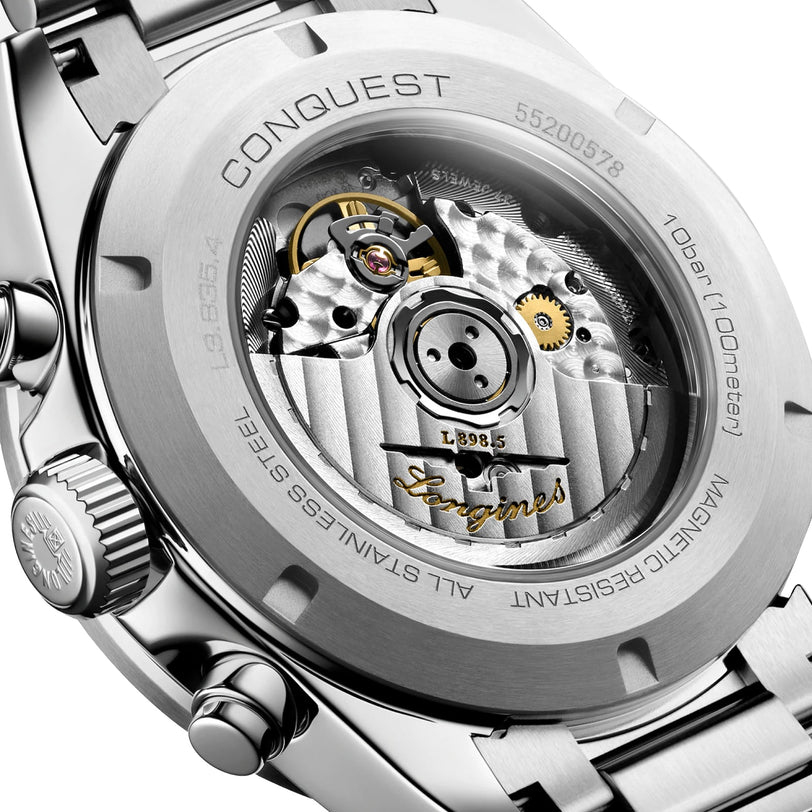 Close-up of the Longines Conquest Chronographs stainless steel back, revealing its self-winding movement through a transparent case back.