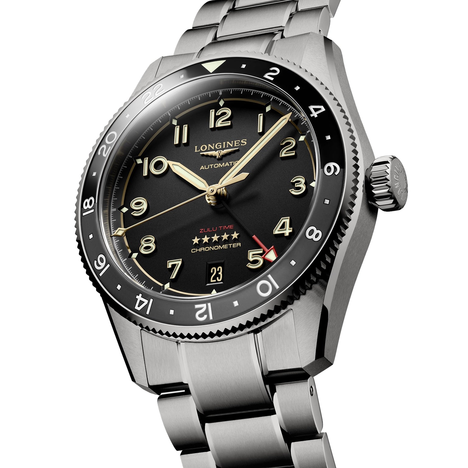 The Longines Spirit Zulu Time, a stainless steel wristwatch with black dial, luminous hands and numerals, date at 6 o’clock, GMT calibre, and rotating bezel is shown angled.