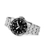 The Tissot Seastar 1000 Powermatic 80 features a silver stainless steel bracelet, black dial with white hour markers, and showcases its precise Powermatic 80 movement against a white background.