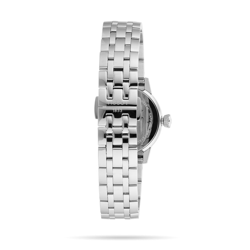 Close-up side view of the Tissot Classic Dream, a silver metal watch with a linked bracelet and visible crown, photographed against a white background—an elegant blend of Swiss quartz movement and timeless style.