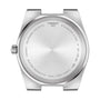 Back of a Tissot PRX stainless steel case engraved with brand name, model number, water resistance details, sapphire crystal info, and Swiss quartz movement information.