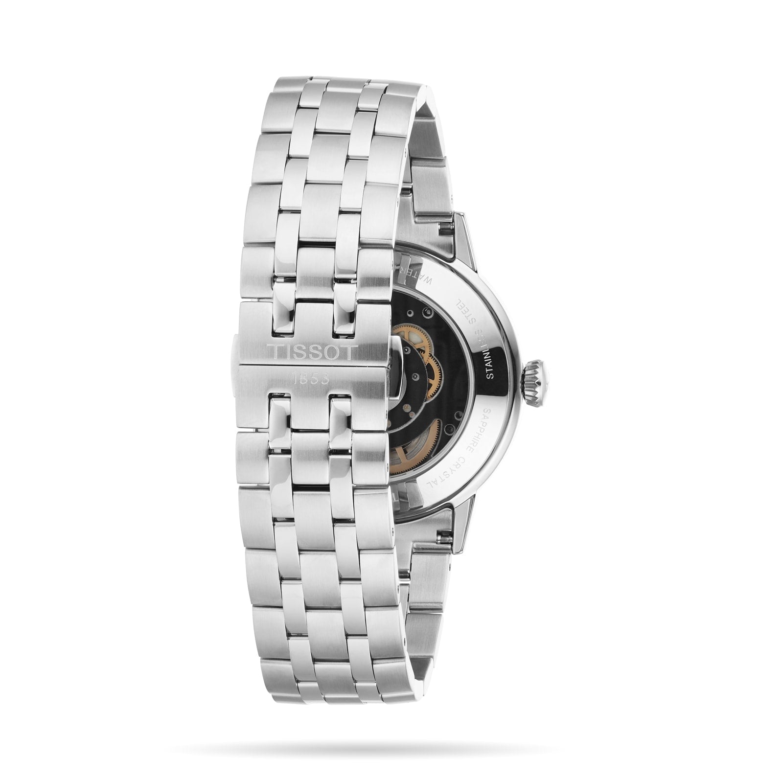The Tissot Classic Dream Swissmatic is a silver metal watch with a linked bracelet, featuring an exhibition case back that reveals the inner mechanism.