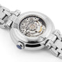 Close-up of the back of the Tissot Bellissima Automatic wristwatch, featuring a transparent case that reveals the intricate Swiss movement and metal bracelet.
