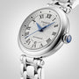 Tissot Bellissima Automatic wristwatch featuring a white dial with Roman numerals, blue hands, a date window at 6 o’clock, and a stainless steel bracelet.