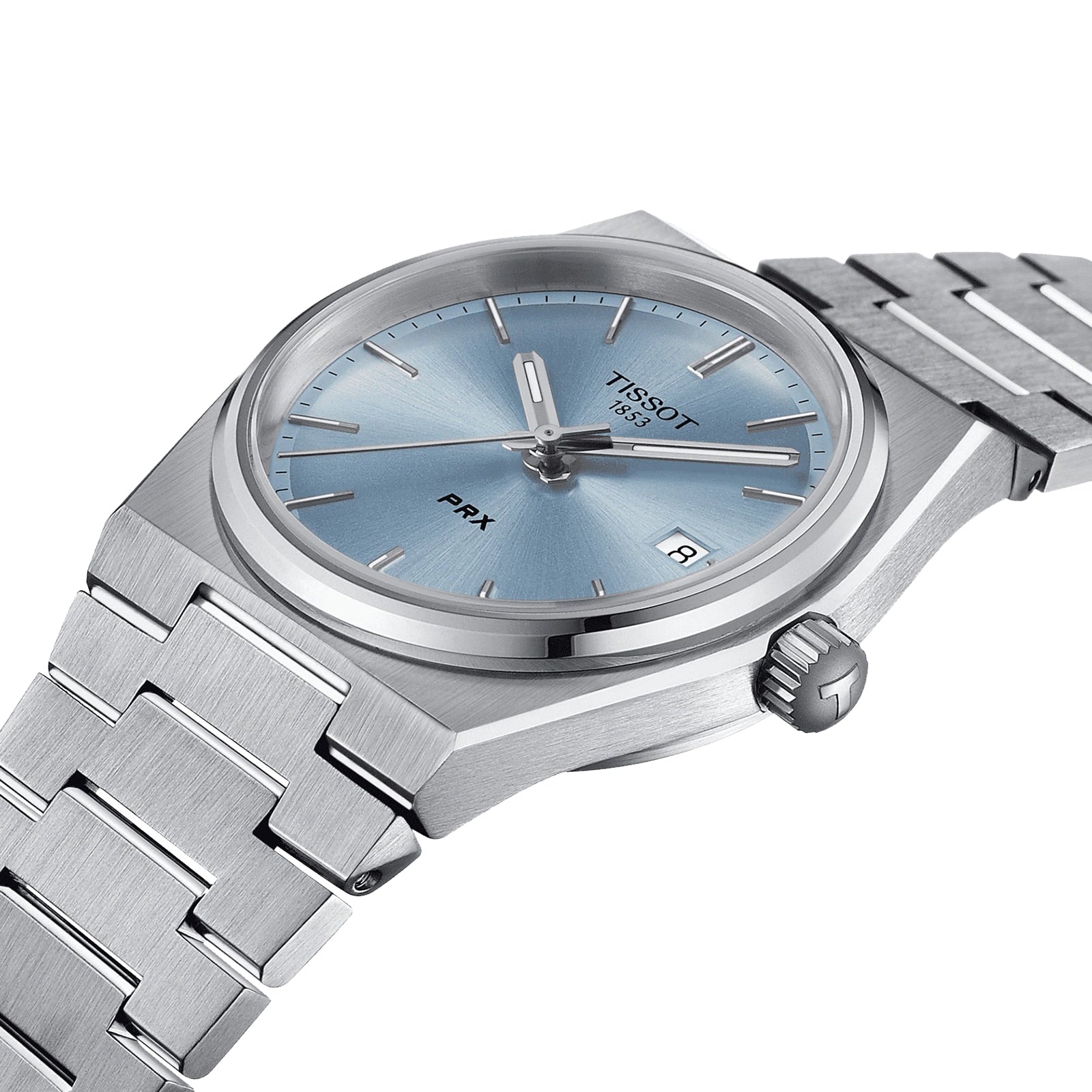 The Tissot PRX features a stainless steel case, blue dial, silver markers, and a date at 3 o’clock. Shown at an angle, it showcases its 1970s-inspired design and Swiss quartz precision.
