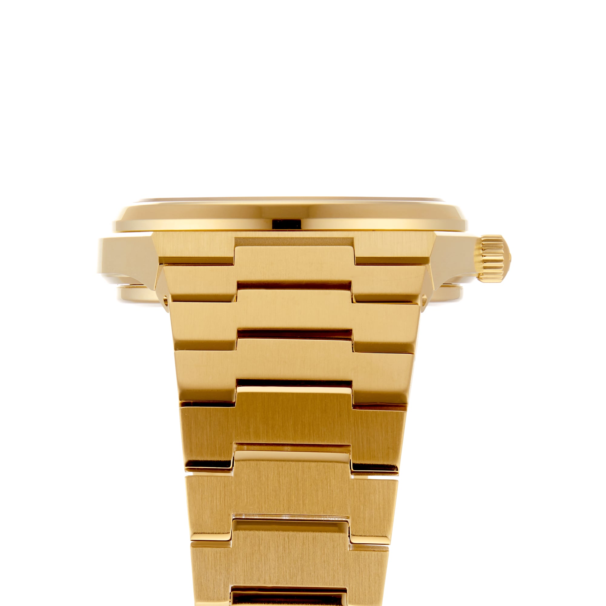 Side view of the Tissot PRX Powermatic 80 in gold, showcasing a metal link bracelet, right-side crown, and the innovative Nivachron hairspring.