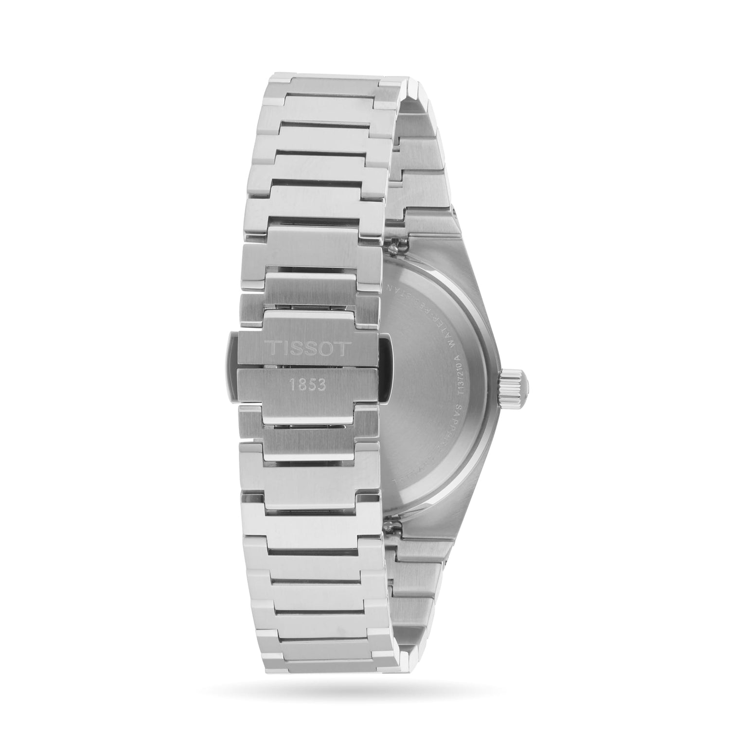 Back view of a Tissot PRX stainless steel wristwatch with metal bracelet and clasp engraved with TISSOT 1853, shown against a plain white background.