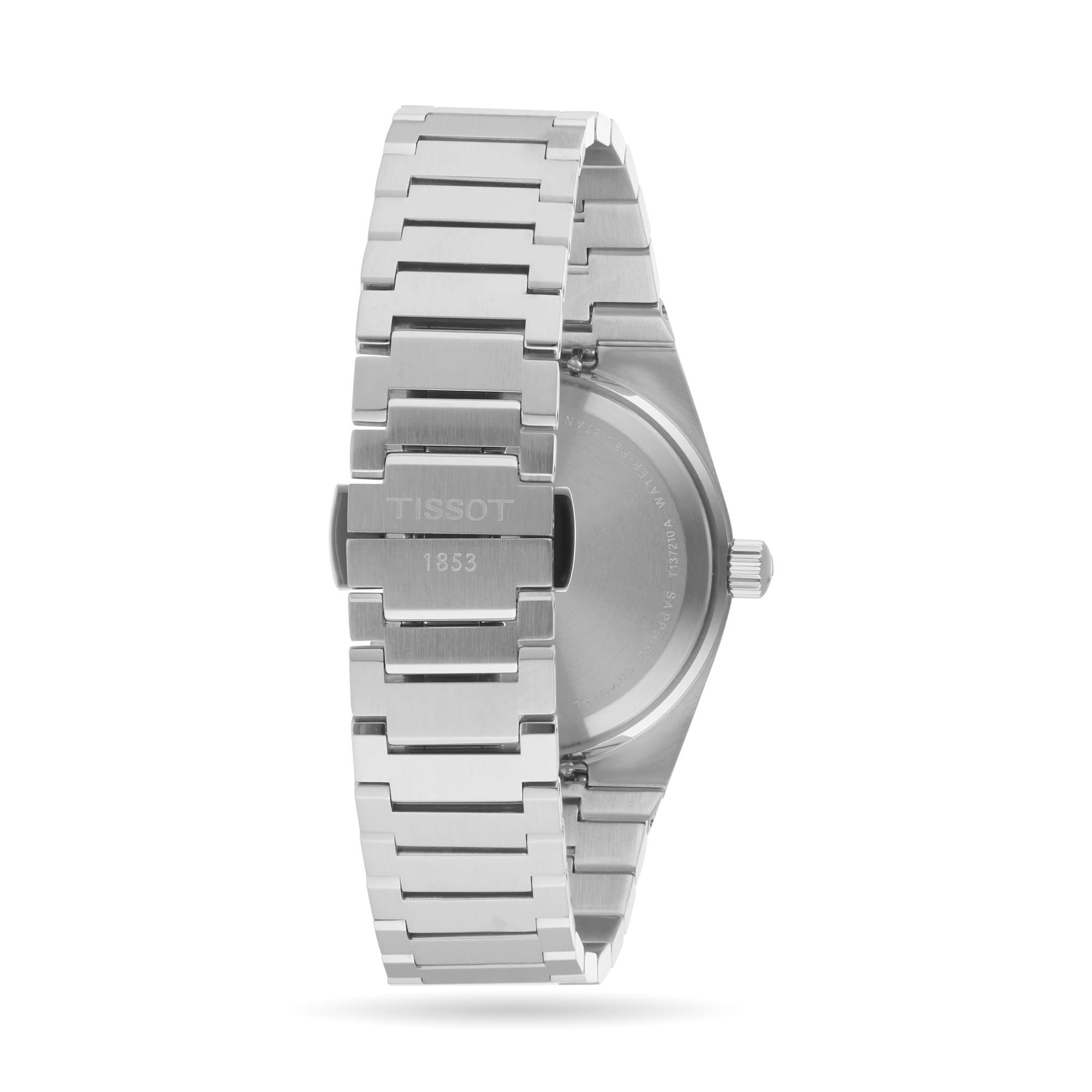 Back view of a Tissot PRX stainless steel wristwatch with metal bracelet and clasp engraved with TISSOT 1853, shown against a plain white background.