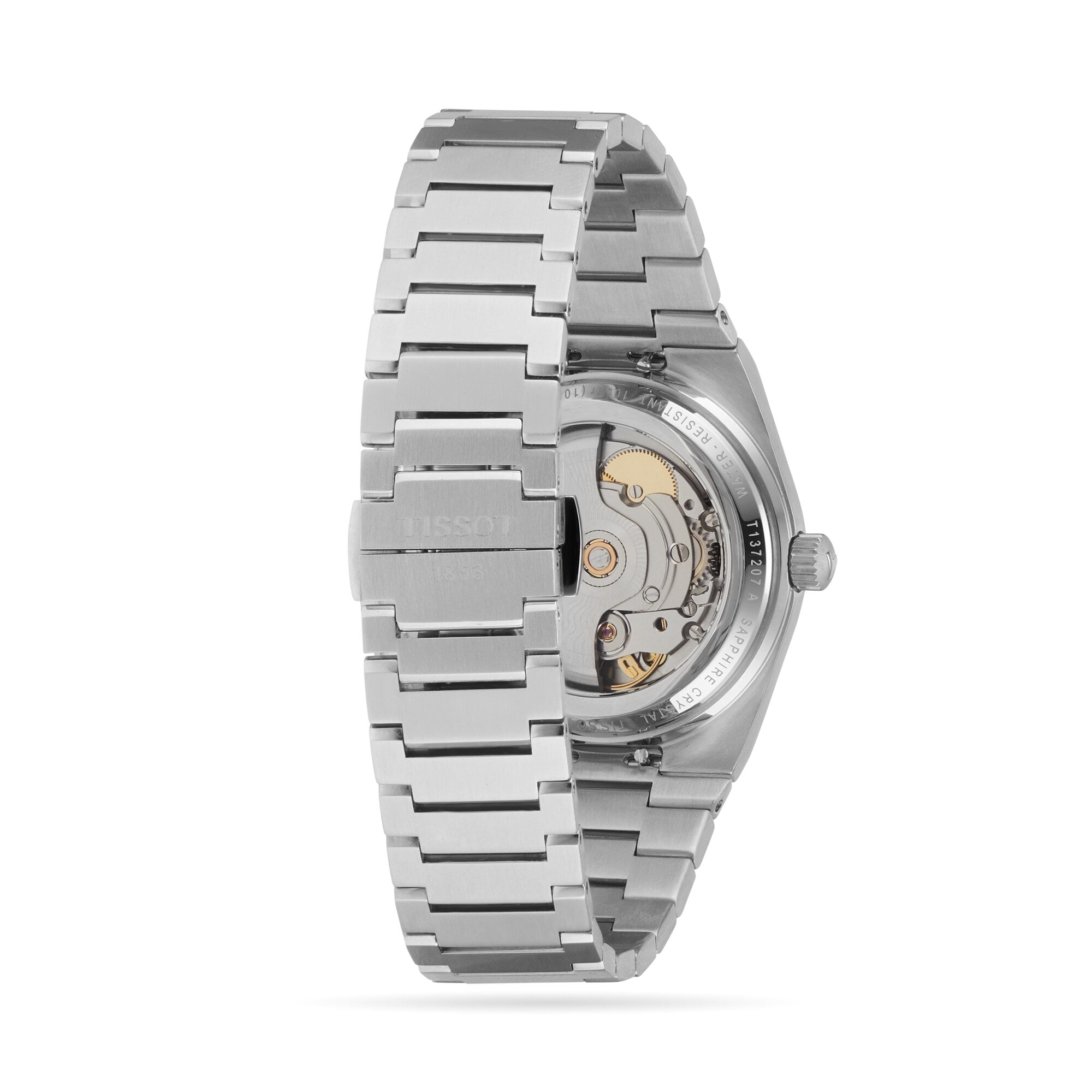 A Tissot PRX Powermatic 80 (35mm) wristwatch in stainless steel shown from the back, highlighting its transparent case back, visible mechanical movement, and glimpses of the vivid green dial.