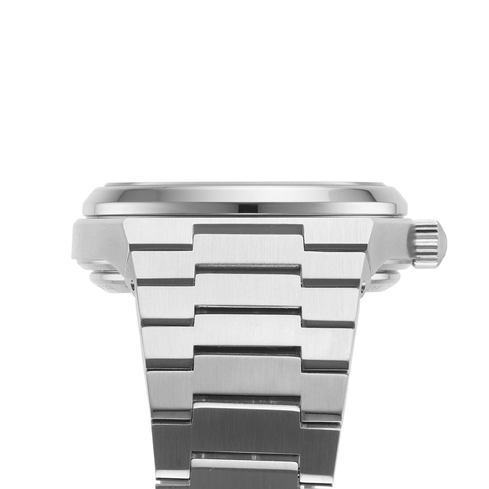 Close-up side view of the Tissot PRX Powermatic 80, a 35mm stainless steel watch with a metal link bracelet, ridged crown, and striking green dial, showcased against a white background.