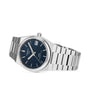The Tissot PRX Powermatic 80 boasts a textured blue dial, silver hour markers, and a date window at 3 o’clock, all powered by the dependable Powermatic 80 movement.