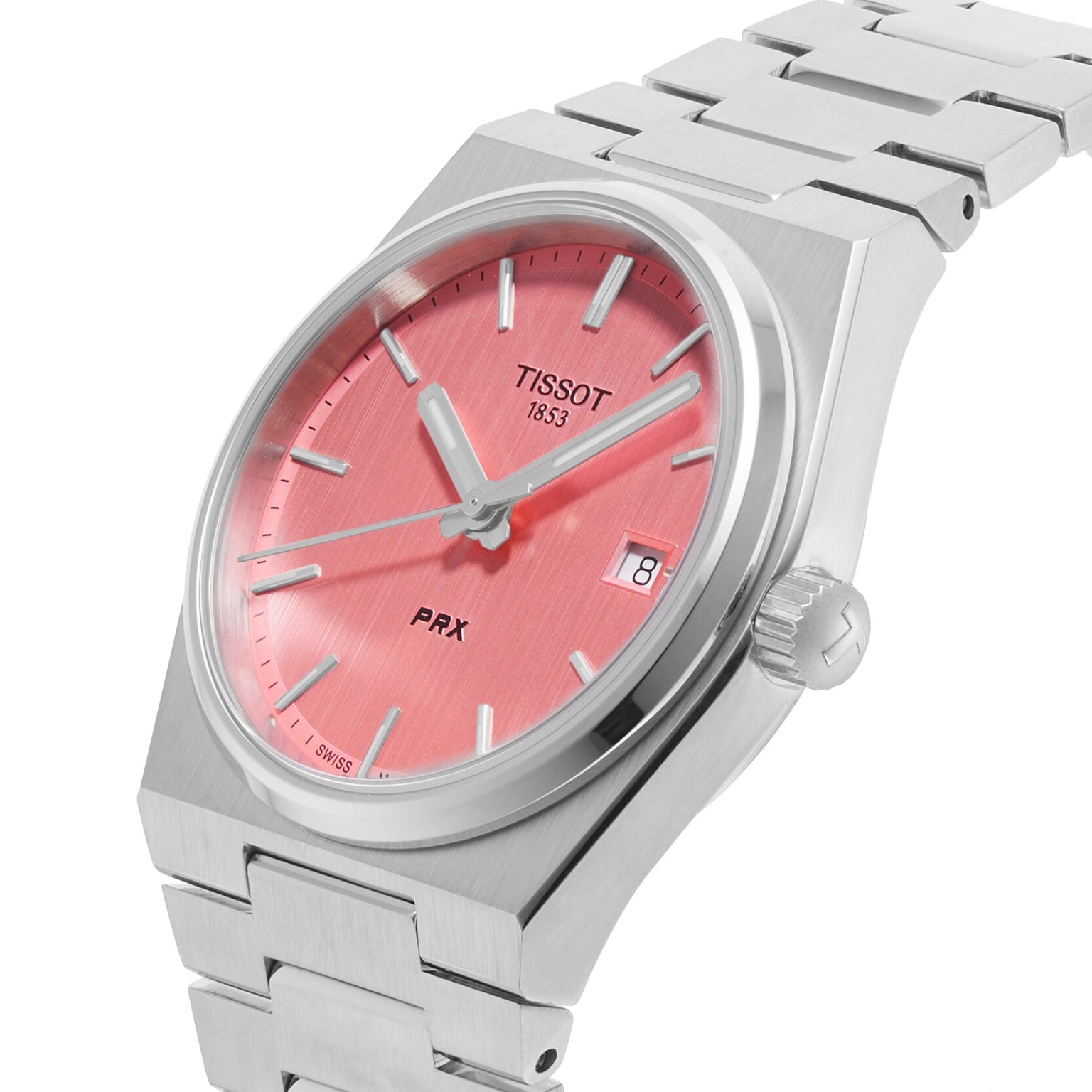 The Tissot PRX is a retro watch with a pink dial, silver hour markers, a date display at 3 o’clock, and a stainless steel bracelet.