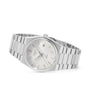 The Tissot PRX watch features a metal bracelet and a white dial, displayed against a white background.