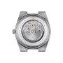 The back of the Tissot PRX Powermatic 80 showcases its exposed automatic movement, Nivachron hairspring, detailed engravings, and sleek stainless steel bracelet.