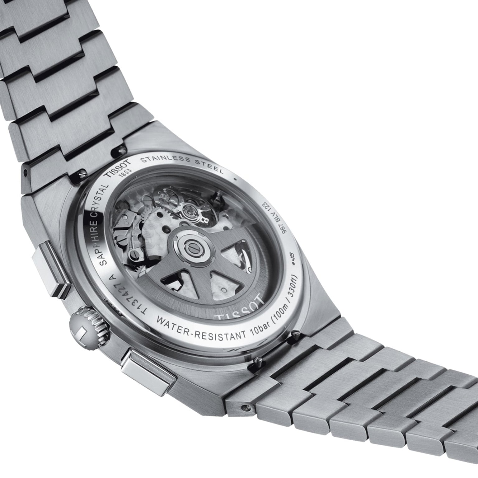 The Tissot PRX Automatic Chronograph features a stainless steel case and a transparent back that reveals its automatic movement.
