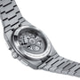 The Tissot PRX Automatic Chronograph features a stainless steel case and a transparent back that reveals its automatic movement.