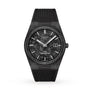 A Tissot PRX Powermatic 80 Carbon watch featuring a textured black dial, date display, and black rubber strap is displayed on a white background.