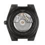 Back view of the Tissot PRX Powermatic 80 Carbon, showcasing its forged carbon case, sapphire crystal, automatic movement, and engraved specs such as water resistance and model details.
