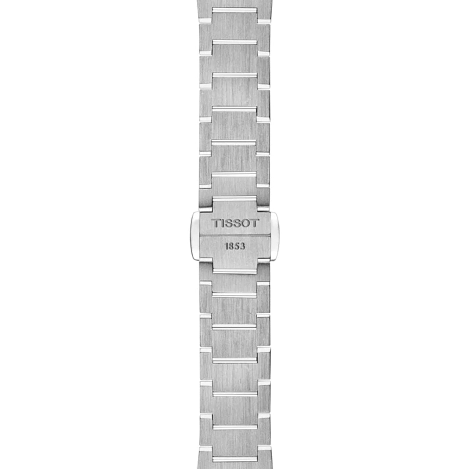 The Tissot PRX stainless steel watch bracelet features a clasp engraved with Tissot 1853, displayed vertically on a white background, highlighting the brand’s modern-vintage style.