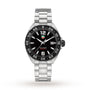 The TAG Heuer Formula 1 Date features a stainless steel case, black dial with silver indices, date window at 3 oclock, and a unidirectional black bezel—powered by quartz movement.