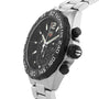The TAG Heuer Formula 1 Chronograph features a black tachymeter bezel, black dial with three subdials, chronograph functions, and a stainless steel link bracelet.