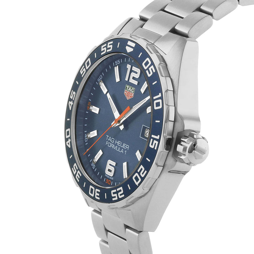The TAG Heuer Formula 1 Date wristwatch features a blue sunray dial, silver hour markers, and a stainless steel bracelet; shown at an angle.