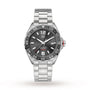 The TAG Heuer Formula 1 Date is a stainless steel wristwatch featuring a black dial, tachymeter bezel, date display at 3 o’clock, and a brushed metal bracelet.
