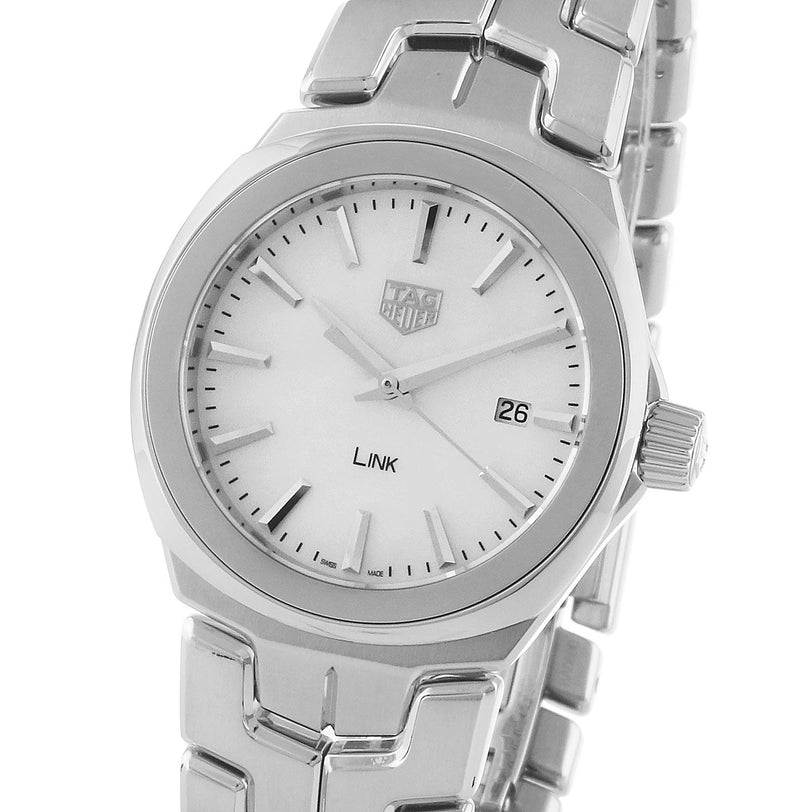 The TAG Heuer Link Date features a white dial, silver hour markers, date display at 3 o’clock, and the iconic S-shaped bracelet.