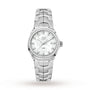 A TAG Heuer Link Date wristwatch with a diamond-set bezel, mother-of-pearl dial, date display at 3 o’clock, and stainless steel bracelet is shown on a white background.