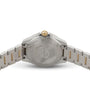 The image shows the back view of a TAG Heuer Aquaracer Date stainless steel sports watch, featuring a gold crown and gold accents on the bracelet.