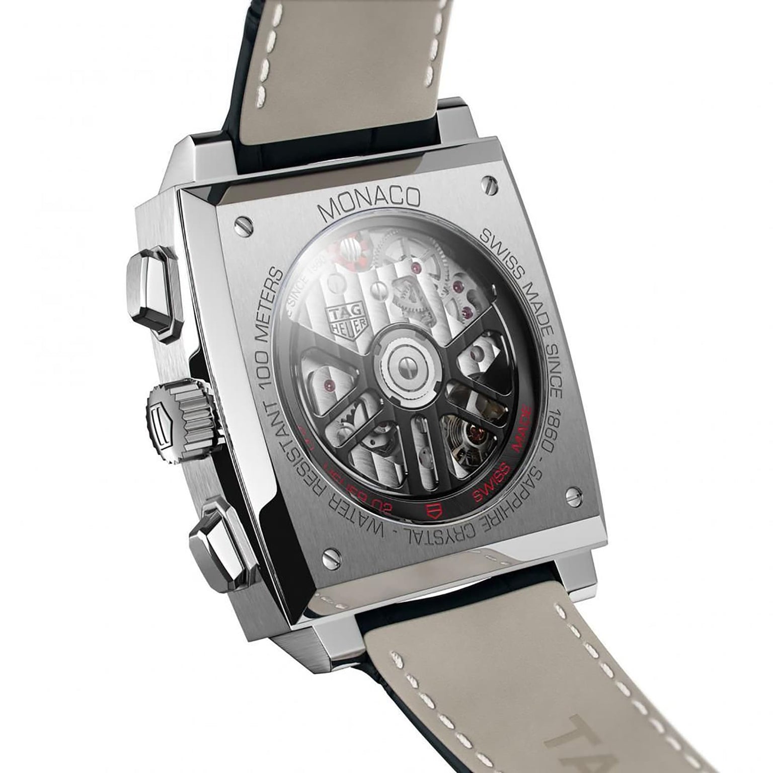 Close-up of the back of the TAG Heuer Monaco Chronograph, highlighting its square case, transparent back revealing the intricate movement, and finely engraved metal details.