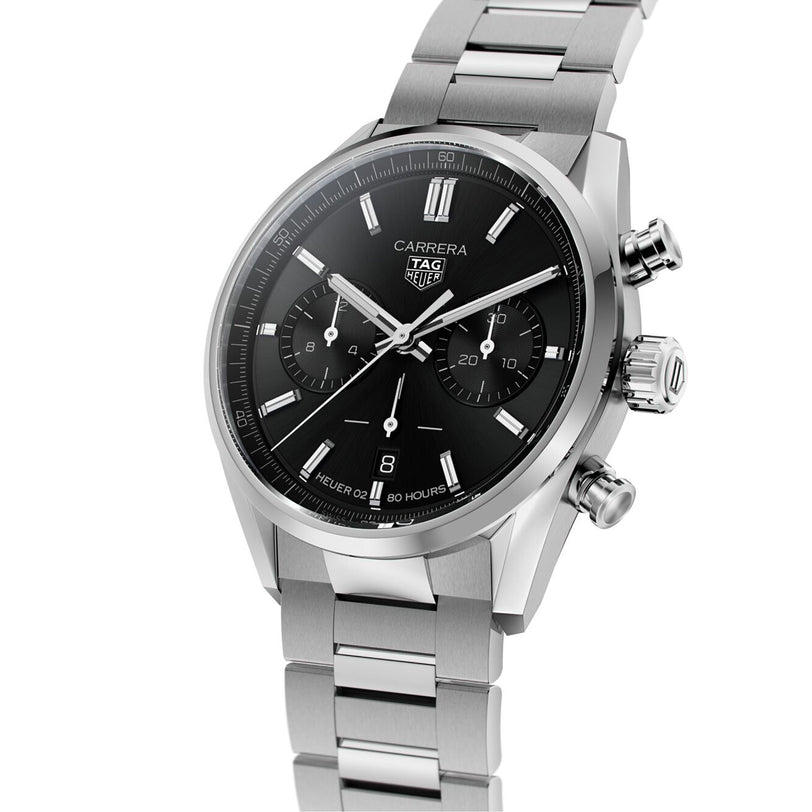 The TAG Heuer Carrera Chronograph features a stainless steel case, black dial with two subdials, date at 6 o’clock, metal link bracelet, and Heuer 02 movement inspired by the brand’s motor-racing heritage.