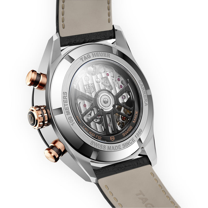 Close-up of the TAG Heuer Carrera Chronograph’s transparent case back, detailed engravings, and brown leather strap—highlighting its motor-racing heritage and signature craftsmanship.