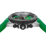 Side view of the TAG Heuer Formula 1 Chronograph with a green strap, black bezel with white numerals, visible crown and pushers on a silver case, and precise quartz movement.