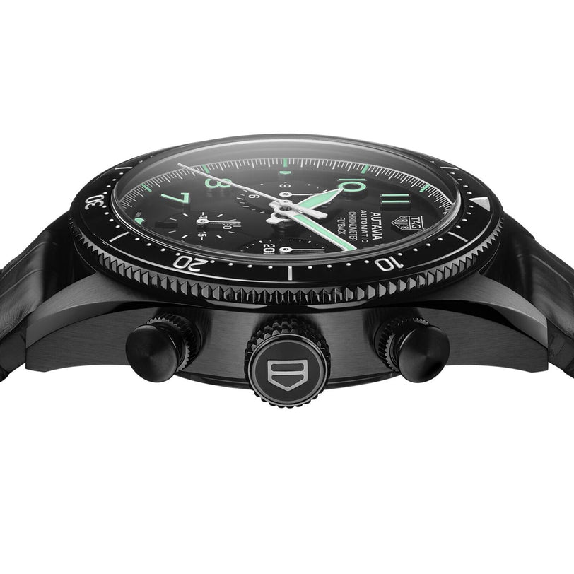 Close-up side view of the TAG Heuer Autavia Flyback Chronometer, featuring a black dial with luminous hands and markers, two pushers, a crown, a rotating bezel, and the advanced Calibre 02 Flyback movement.