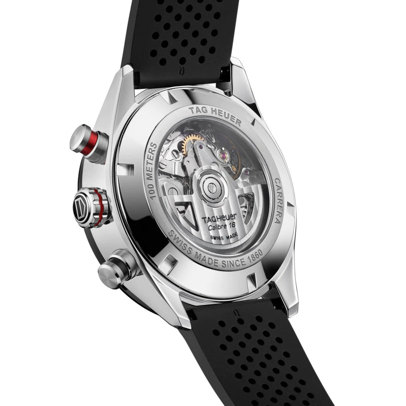 Close-up of the back of a TAG Heuer Carrera Chronograph, highlighting its movement, Carrera branding, and black perforated rubber strap engineered for endurance.